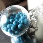 Hollow Glass Pendant Filled With Aqua Beads On A..